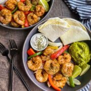 Sheet Pan Shrimp Fajitas in grey round bowls