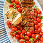 Caprese Steak with Fig Balsamic on white oval plate