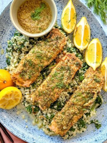 Mustard dill salmon on a large oval blue dish