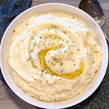 whipped mashed potatoes in large round white bowl