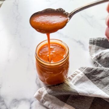 Paleo Catalina Dressing in glass jar with spoon