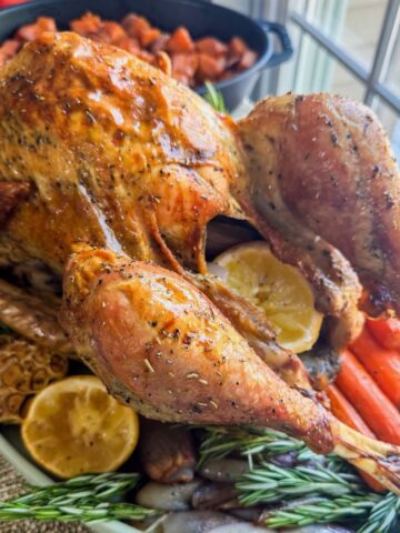 Roast Turkey on large oval green platter with veggies