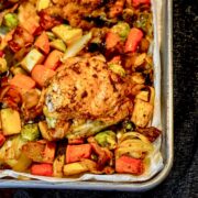 chicken vegetable sheet pan with black towel