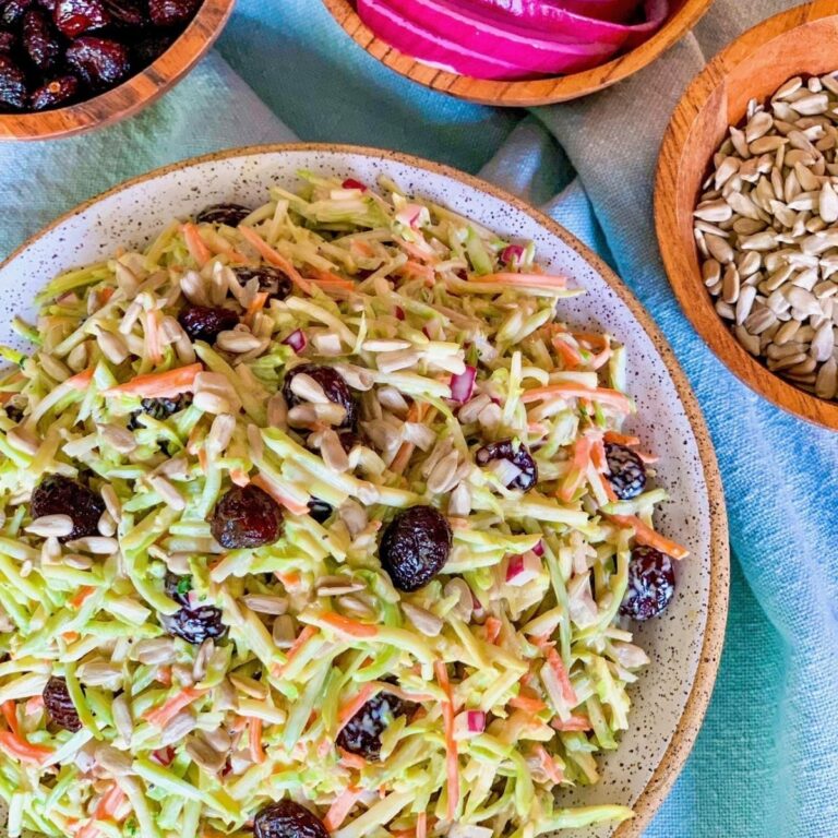broccoli salad with cranberries in round oatmeal bowl