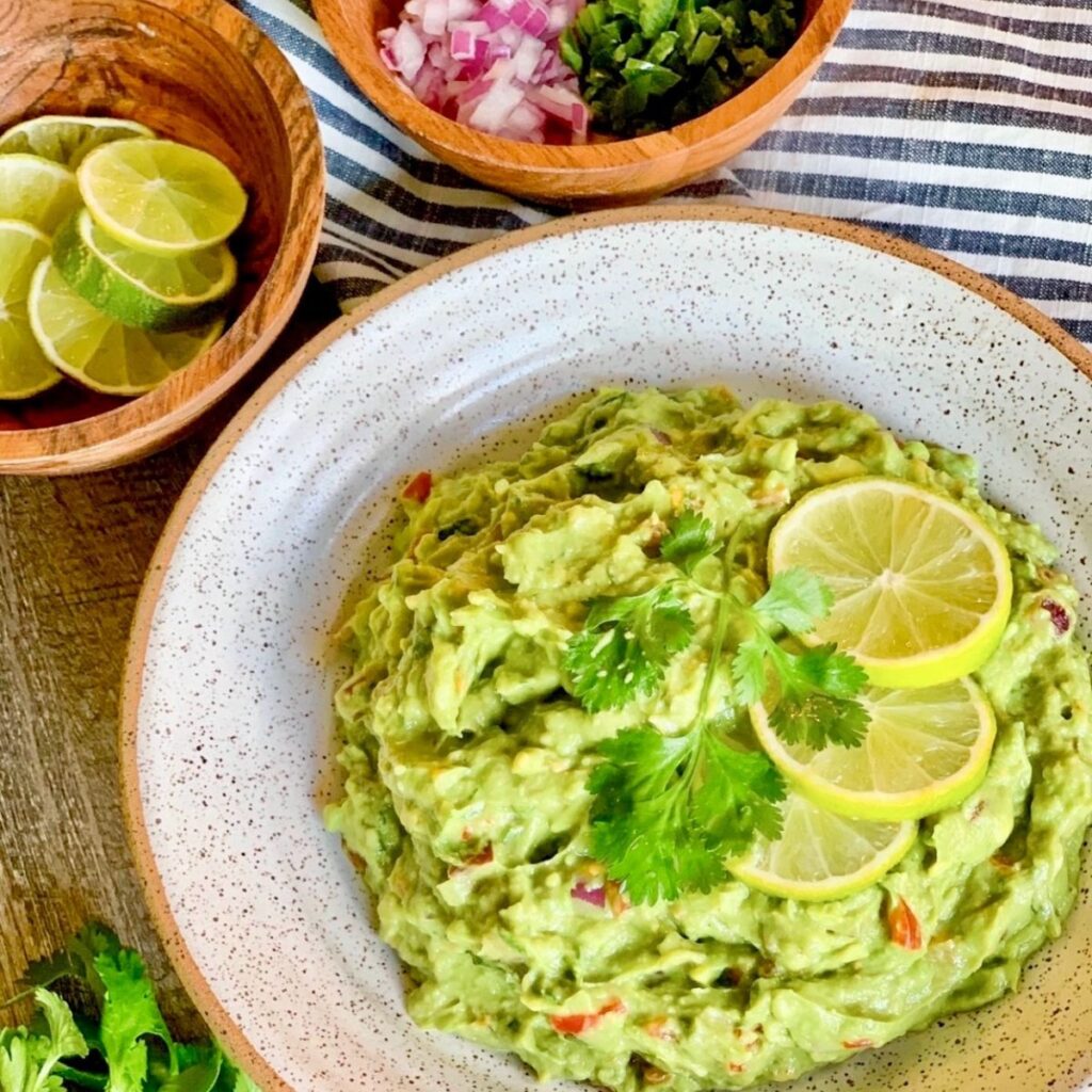 guacamole in a round white bowl