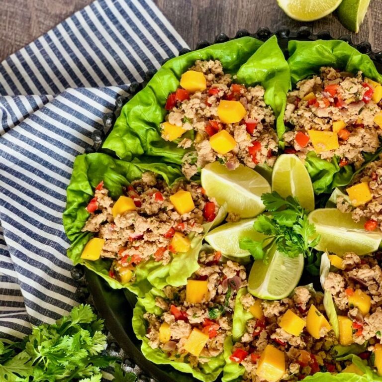 Jerk Chicken Mango Cups on round black platter