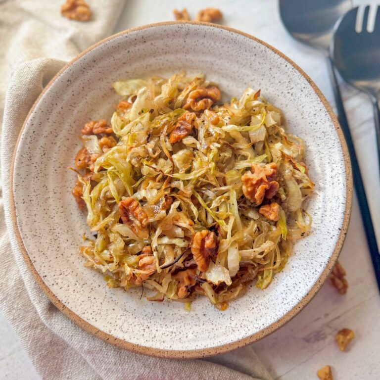 maple walnut roasted cabbage in round oatmeal colored bowl