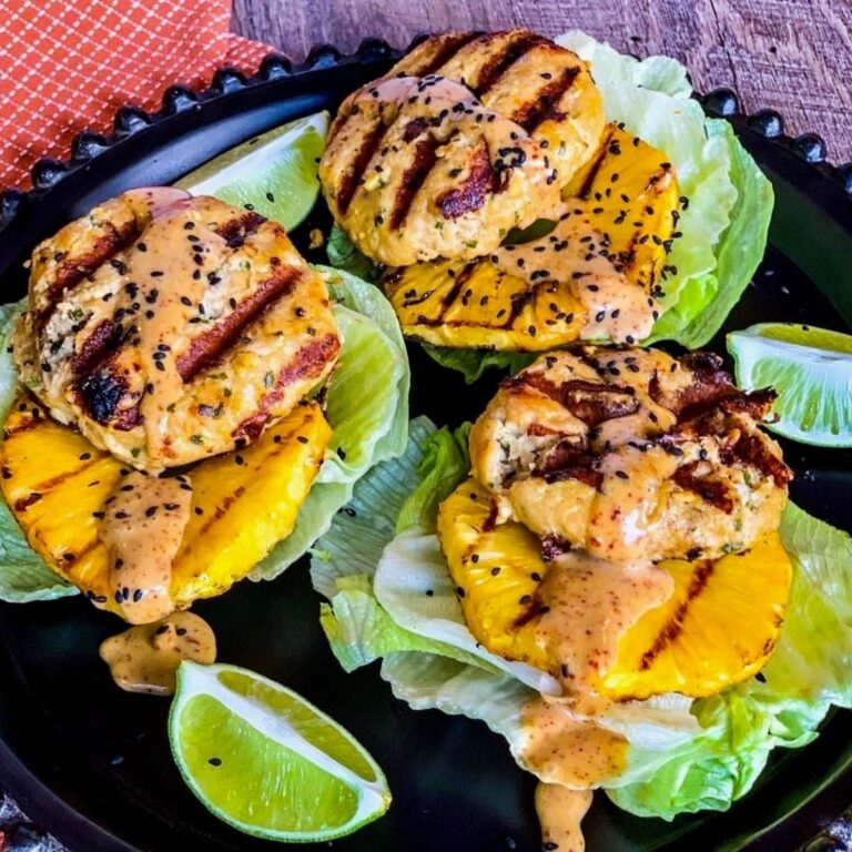 Grilled Teriyaki Chicken Burgers (with Pineapple) on black round plate