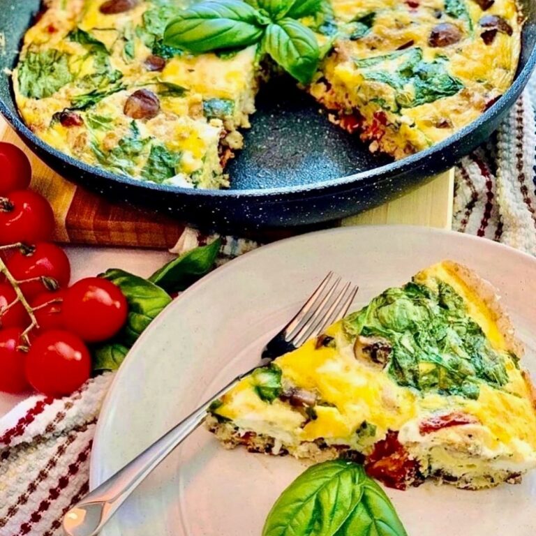 tuscan frittata on round white plate and in fry pan