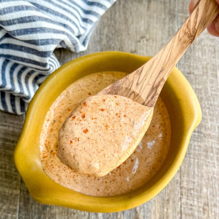 Best Taco Salad Dressing in gold pottery bowl with wood spoon
