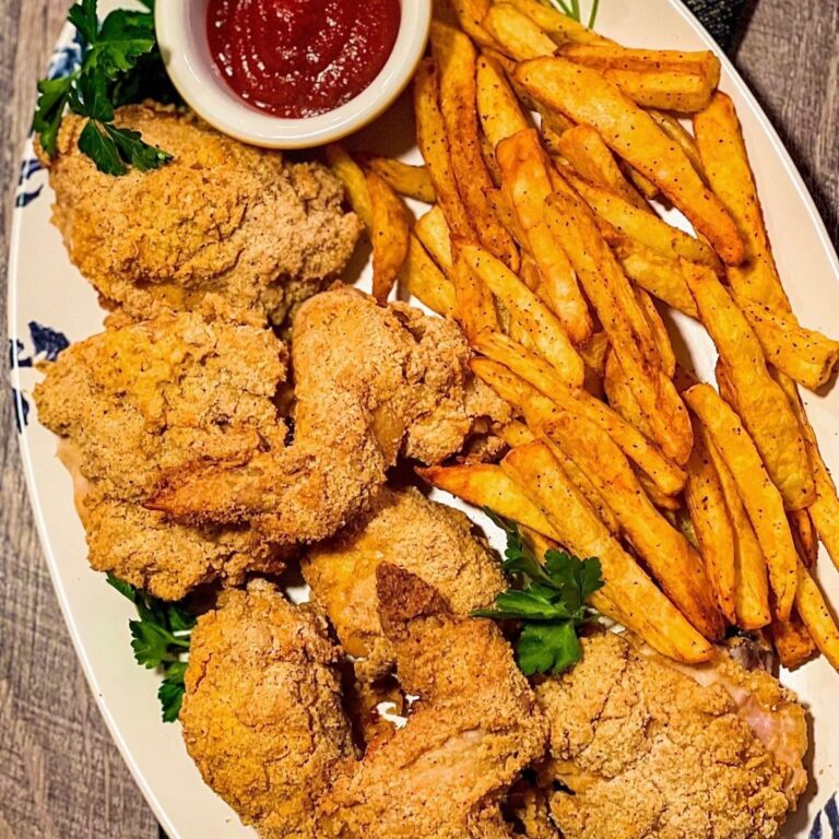 Copycat Popeye's Chicken and fries and sauce on large oval platter