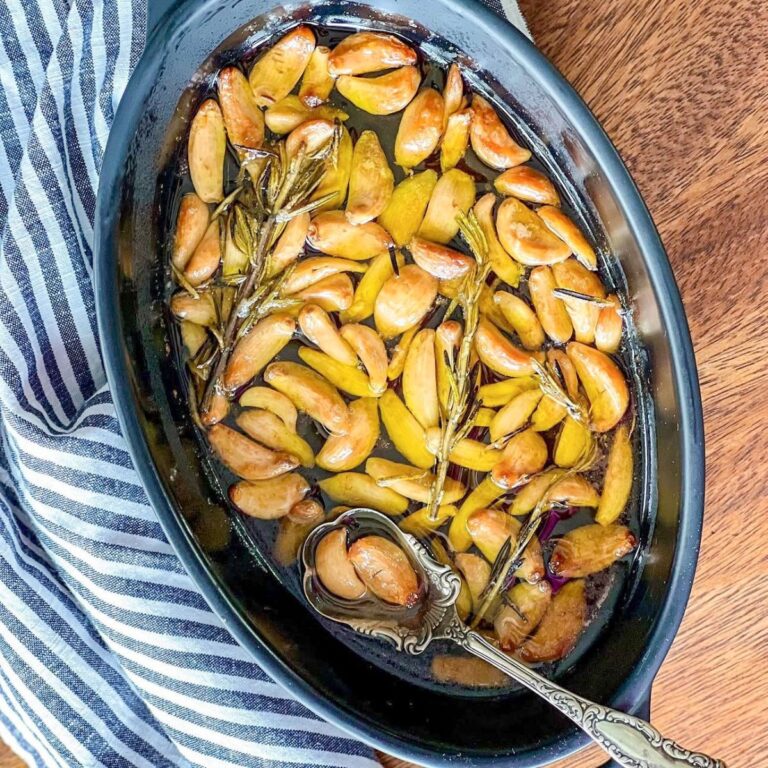 Garlic confit in black oval staub