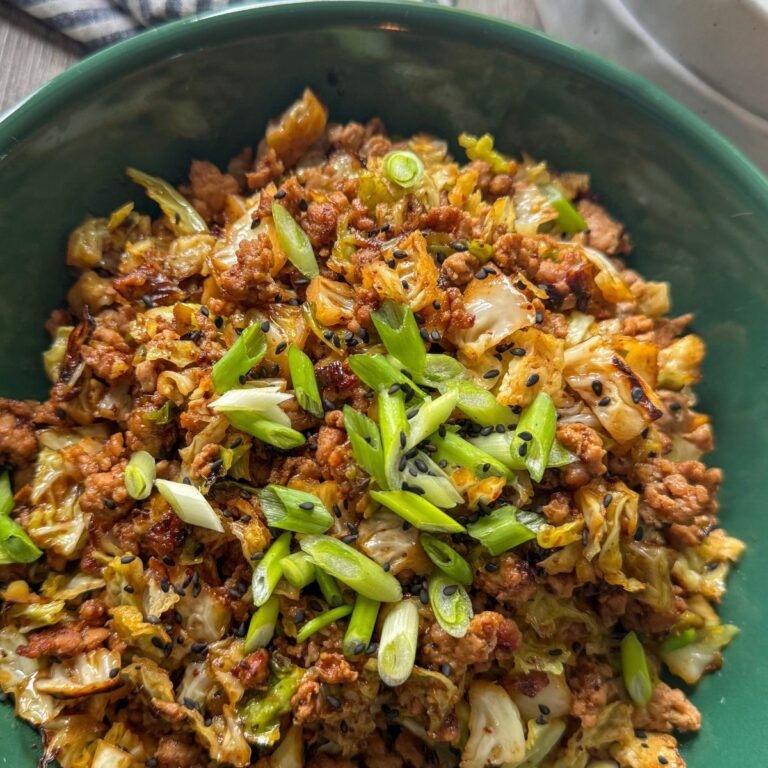 teriyaki pork and cabbage in round green bowl