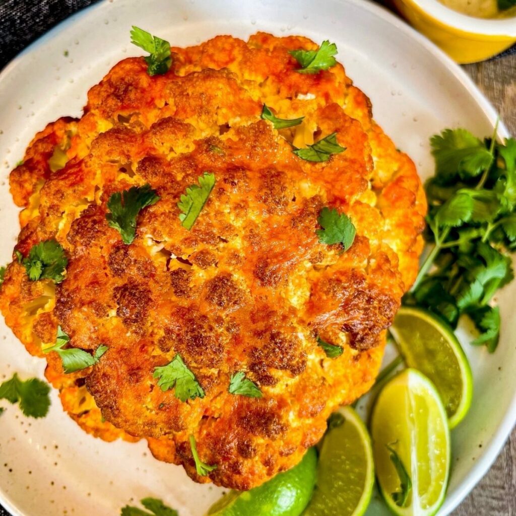 air fryer buffalo cauliflower on round white plate