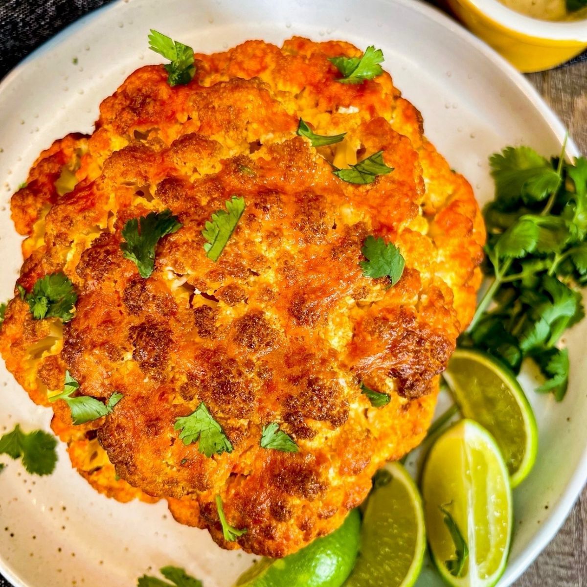 air fryer buffalo cauliflower on round white plate
