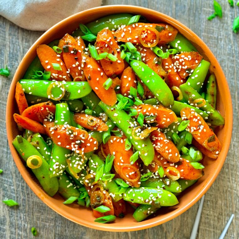 teriyaki carrots and sugar snap peas with scallions and sesame seeds